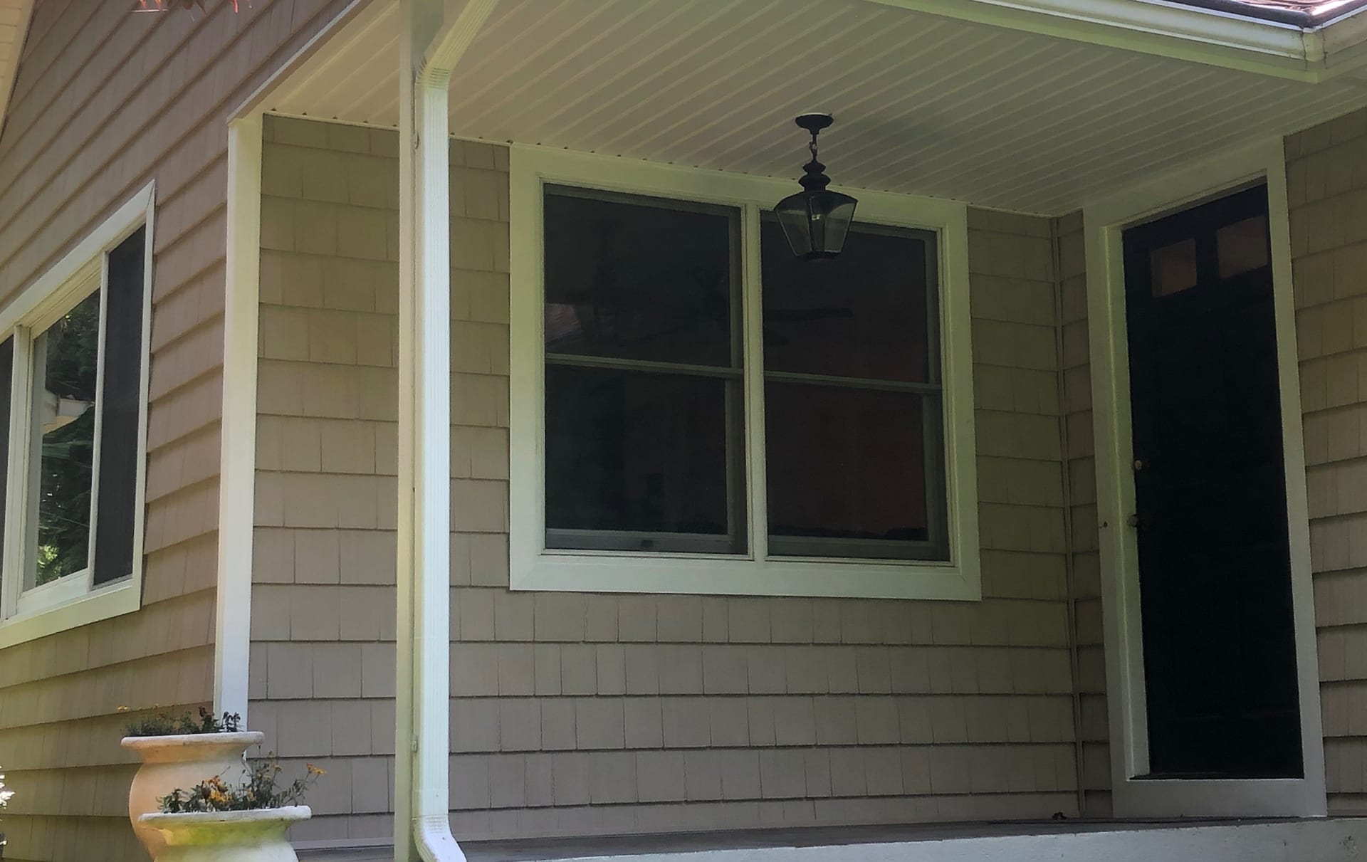 Beige CertainTeed vinyl cedar shake siding with white Azek trim on a North Jersey home